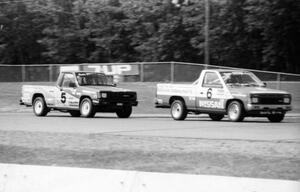 Max Jones' Nissan Pickup holds off Peter Farrell's Dodge D-50 during the race.