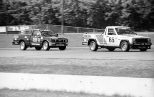 Rick Stevens' Jeep Comanche and Jack Dysart's Isuzu P'up battle further back in the pack.