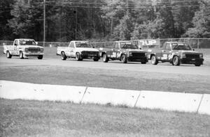 Tommy and Bobby Archer's Jeep Comanches hold off Steve Lewis' Toyota Pickup and Tim Evans' Ford Ranger during the race.