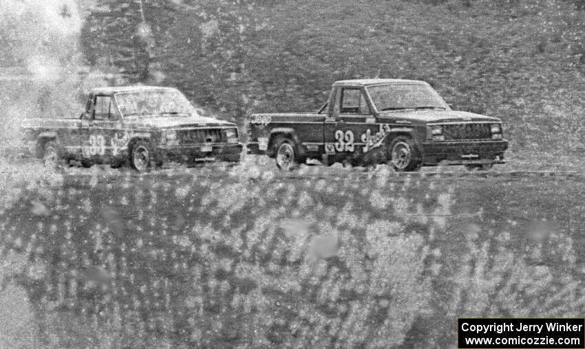 Bobby Archer leads brother Tommy out of turn six in their Jeep Comanches during qualifying.