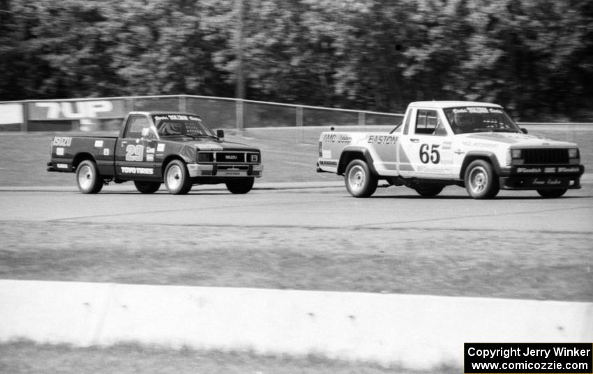 Rick Stevens' Jeep Comanche and Jack Dysart's Isuzu P'up battle further back in the pack.