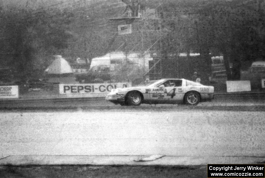The Bobby Archer / Tommy Archer Chevy Corvette spins at turn ten while leading in the rain.