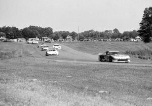 Paul Newman's Nissan 300ZX Turbo leads the field through 7/8 on lap one.