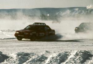 Tommy Archer / Bobby Archer Chevy Spectrum Turbo chased by the Chris Menard / Jon Kurshinsky Dodge Omni GLH-S on lap one.