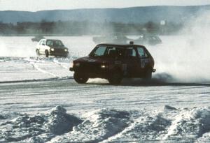 Randy Christman / Paul Hubenette VW GTI chased by the Kevin Carlstrom / Dan Otto VW GTI