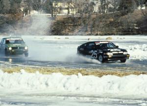 The Parker Johnstone / Mark Wolocatiuk Honda CRX passes the John Madison / Randy Christman VW Rabbit before the front straight.