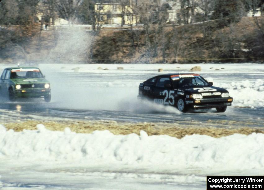 The Parker Johnstone / Mark Wolocatiuk Honda CRX passes the John Madison / Randy Christman VW Rabbit before the front straight.