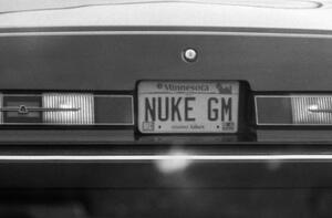 License plate on the back of a Ford Thunderbird.