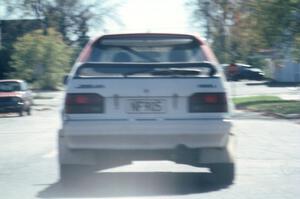 Rod Millen / Harry Ward in their Gr. A Mazda 323GTX in transit to SS2.