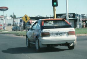 Rod Millen / Harry Ward in their Gr. A Mazda 323GTX in transit to SS2.