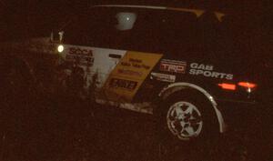 Richey Watanabe / Howie Watanabe at night in their Gr. A Toyota Corolla FX-16.