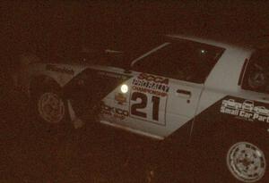 Carl Kieranen / Diane Sargent in their Mazda RX-7 at night.