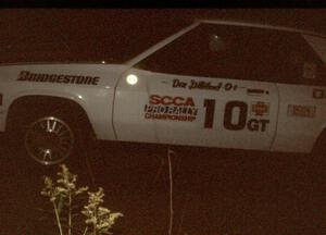 Dan Gilliland / Betty-Ann Gilliland in their Dodge Shelby at night.