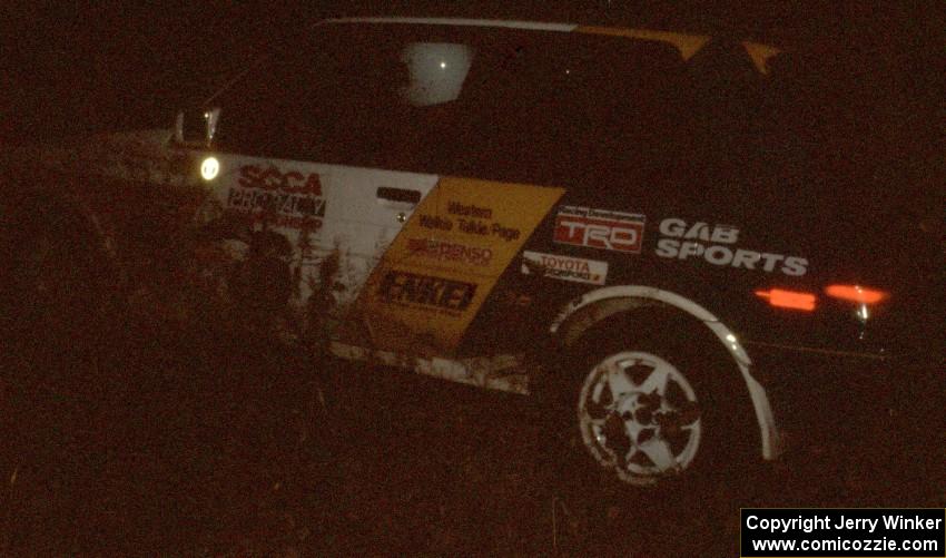 Richey Watanabe / Howie Watanabe at night in their Gr. A Toyota Corolla FX-16.