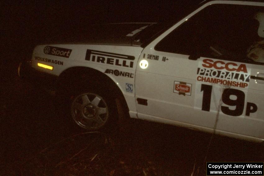 Nelson Shepard / Tom Burgess in their P class VW GTI at night.