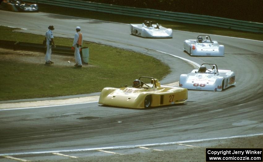 The field streams through Canada Corner on lap one.