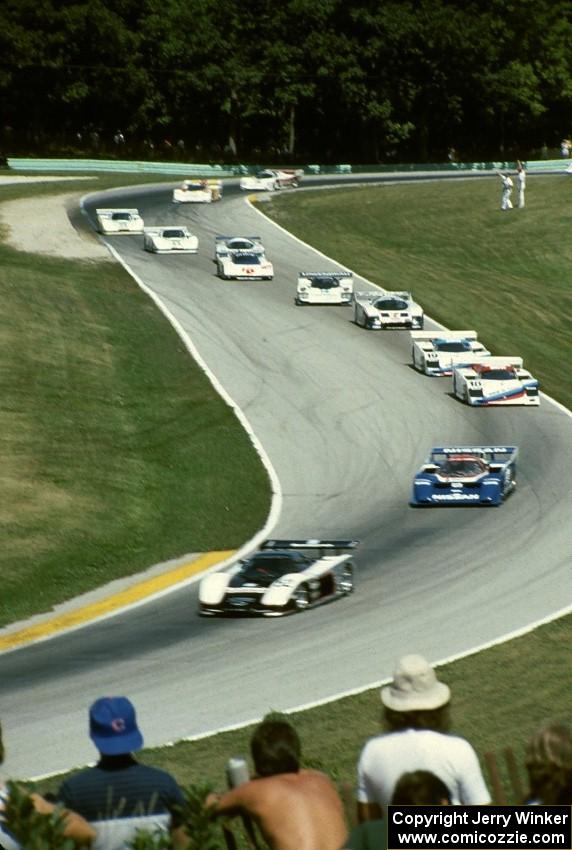 The field comes through turns 6 and 7 on the pace lap.