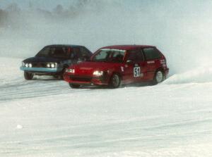 The John Kochevar / Mark Carter Honda Civic battles the Dave Kapaun / Dustin Smith VW Scirocco.