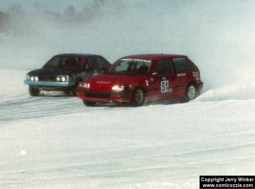 The John Kochevar / Mark Carter Honda Civic battles the Dave Kapaun / Dustin Smith VW Scirocco.