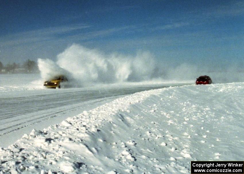 The Mike Gardner / Jake Gardner VW GTI goes wide while the Troy Greenberg / Troy Young Honda CRX slips by.