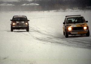 Kyle Smith / Paul Gilbert VW Rabbit and Bill Japp / Rob Edwards VW Rabbit on the front straight.