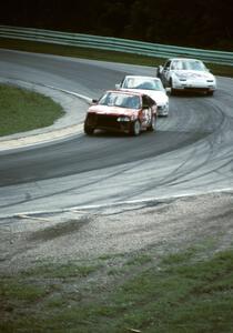 Norris Rancourt / John Green Honda CRX and a Porsche 944 and the Mark Stavros / Steve Sturges Nissan 300ZXT in Canada Corner
