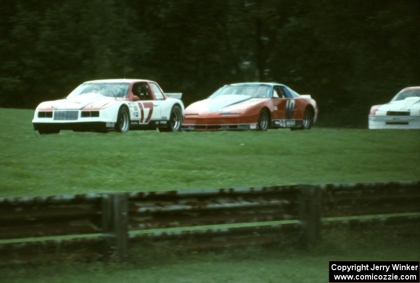 Dick Danielson's Buick Somerset leads Clay Young's Pontiac Firebird and Jerry Thompson's Chevy Beretta