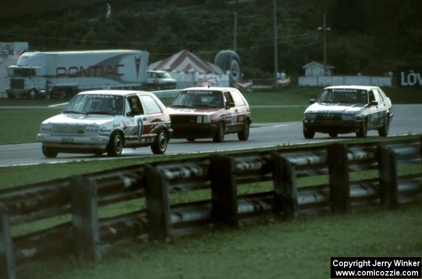 The VW GTIs of Paul Hacker / Karl Hacker and ??? / ??? and Alfa-Romeo Milano of Duncan MacLean / Scott MacLean