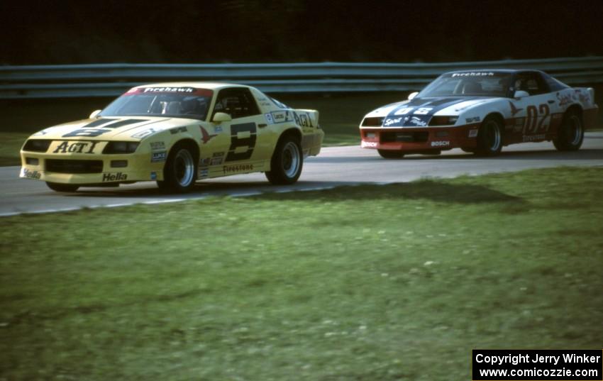 Skip Gunnell / Scott Flanders Chevy Camaro chased by the John Petrick / Glen Cross Chevy Camaro