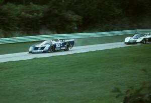 Elliott Forbes-Robinson / John Morton Nissan GTP ZX-T leads Sarel van der Merwe / Doc Bundy Chevy Corvette GTP into turn one.