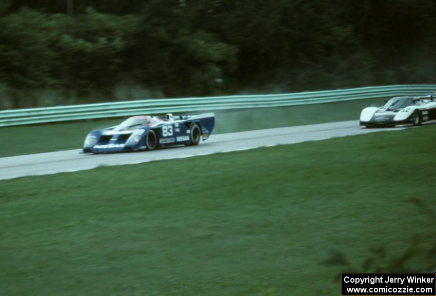 Elliott Forbes-Robinson / John Morton Nissan GTP ZX-T leads Sarel van der Merwe / Doc Bundy Chevy Corvette GTP into turn one.