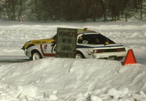 The Cary Kendall / Tony Roggeman Mazda RX-7 makes a pass on the Len Jackson / Bob Brost Datsun 240Z going into turn one.