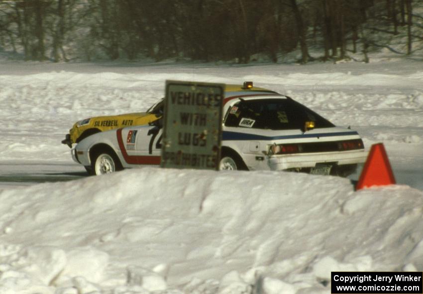 The Cary Kendall / Tony Roggeman Mazda RX-7 makes a pass on the Len Jackson / Bob Brost Datsun 240Z going into turn one.