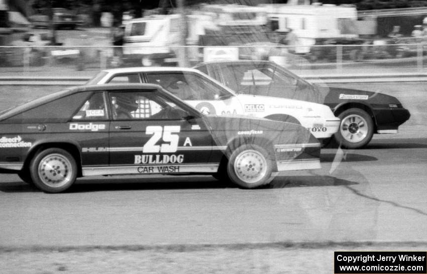 Showroom Stock A Battle: Gerry Mason's Mitsubishi Starion leads Bill Holcomb's Pontiac Sunbird and Chuck Neuman's Dodge Charger