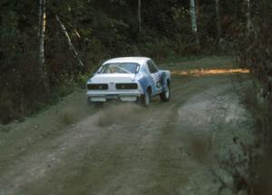 Chuck VanDamme / Thomas VanDamme leave the start of an afternoon stage in their Mazda RX-3.