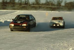 Lee Wuesthoff's Mazda 323GTX and Leighton Reese's Mazda Wankel-powered SAAB Sonnet III battle on lap one