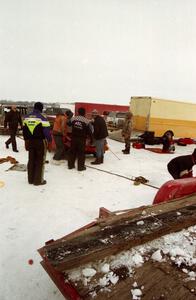 Crew members try to pull the front back on Dave Kapaun's VW Rabbit