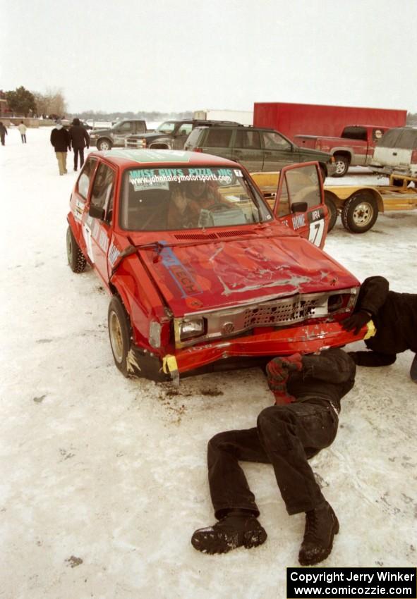 Work is performed to get the Dave Kapaun VW Rabbit ready for the enduro after crashing hard in the modified race.