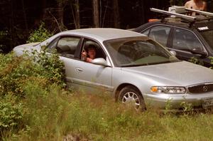 Nicole Valek (now Winker) hangs out in the car to avoid the thick black flies.