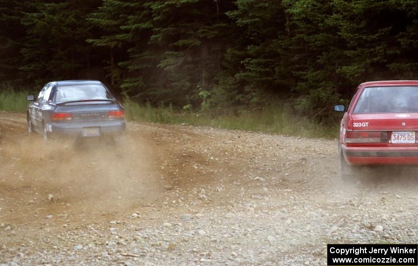 Don Kennedy / Keith Kennedy Subaru Impreza passes the Adam Vale da Serra / Christine Vale da Serra Mazda 323GT