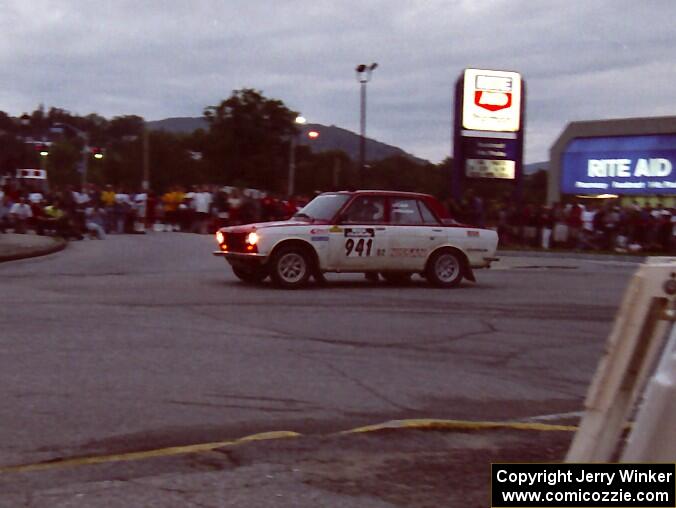 Dan Cook / Bill Rhodes Datsun 510 complete a 360 on SS10 (In Town)
