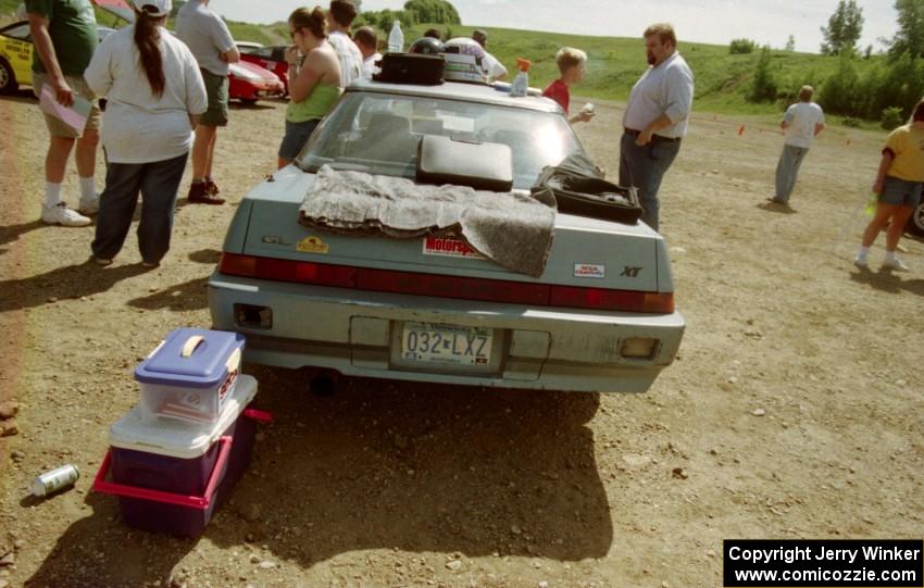 Drivers mill about Todd Erickson's Subaru XT at registration