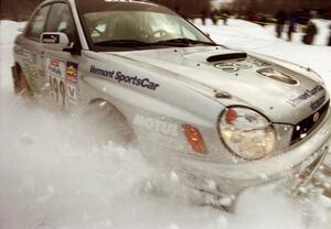 Travis Pastrana / Christian Edstrom Subaru WRX clips the inside bank at the spectator location on SS15 (Hungry 5 I)