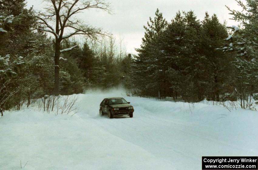 Tom Ottey / Pam McGarvey Mazda 323GTX on SS8 (Rouse)