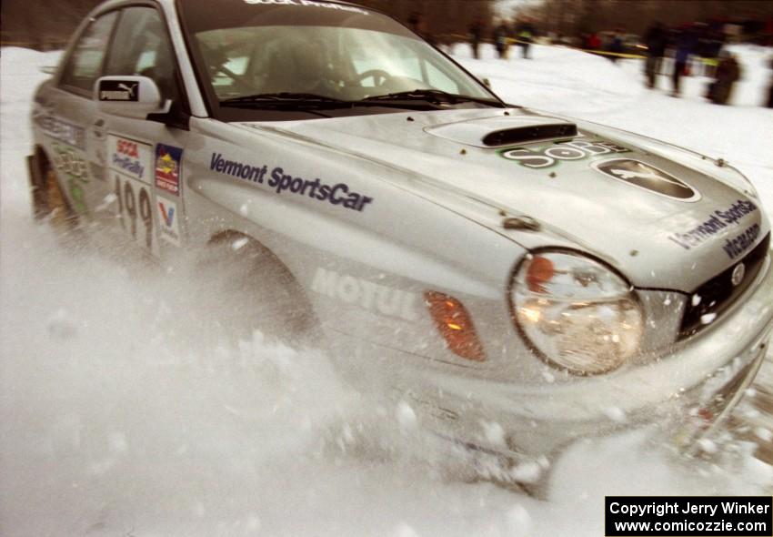 Travis Pastrana / Christian Edstrom Subaru WRX clips the inside bank at the spectator location on SS15 (Hungry 5 I)