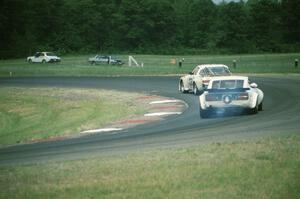 Glen Brown's Mazda RX-7 and Bill Cammack's Datsun 280Z battle for the C Production win in turn 4.