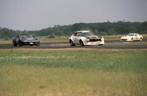 Bill Cammack's GT-2 Datsun 280Z, Bruce Gunderson's GT-1 Chevy Corvette and Glen Brown's GT-2 Mazda RX-7