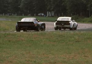 Bill Cammack's GT-2 Datsun 280Z and Bruce Gunderson's GT-1 Chevy Corvette through turn 6