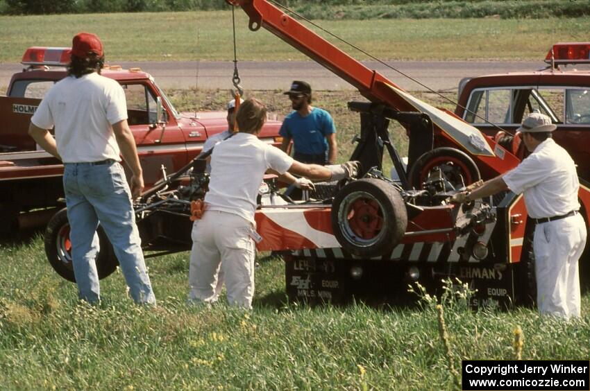 Terry Orr's Lola T-440 Formula Ford gets lifted onto the flatbed