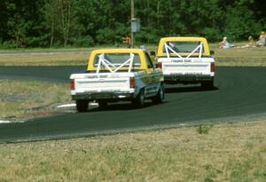 Steve Saleen's and George Follmer's Ford Rangers head through turn 4